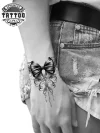 tatouage-poignet-ephemere-noeud-ruban-design-elegant-intemporel tatouage-poignet-ephemere-noeud-ruban-design-elegant-intemporel