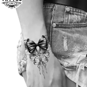 tatouage-poignet-ephemere-noeud-ruban-design-elegant-intemporel tatouage-poignet-ephemere-noeud-ruban-design-elegant-intemporel