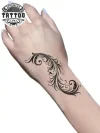 tatouage-poignet-femme-éphémère-plume-élegant-durable tatouage-poignet-femme-éphémère-plume-élegant-durable